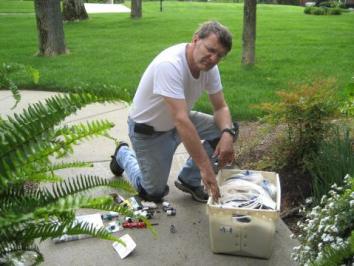 Sausalito sprinkler repair man prepares to install two new heads