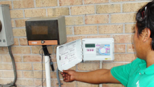 Julio programs a Rain Bird controller during a routine San Rafael sprinkler repair call